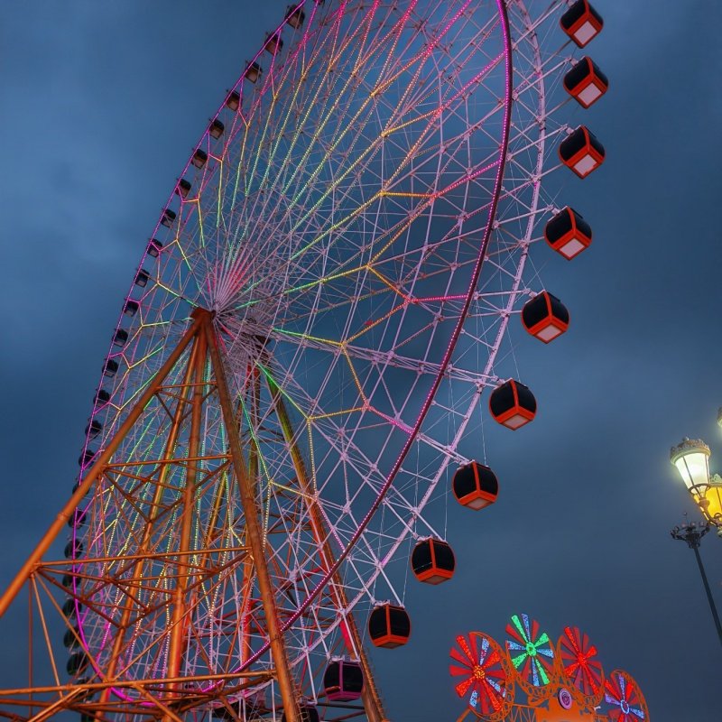 Ferris wheel illuminated at night with colorful LED lights for stunning visual effect 2