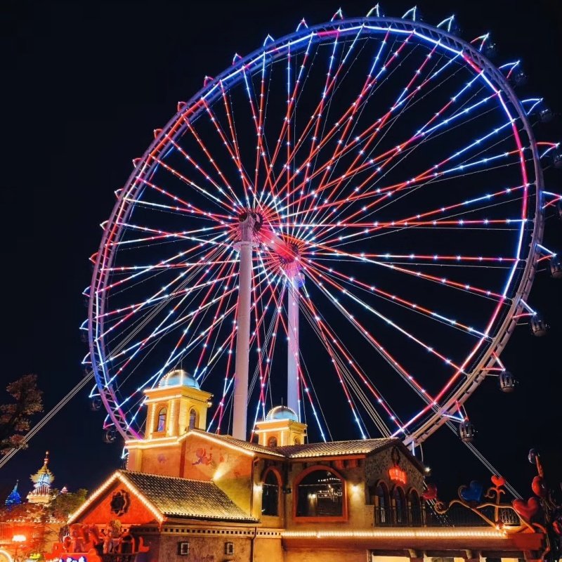 Ferris wheel illuminated at night with colorful LED lights for stunning visual effect 4
